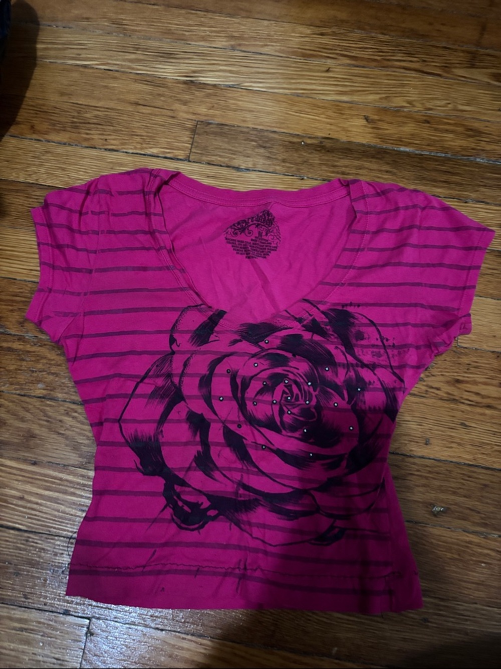Stranded Fuchsia Striped V‑Neck Tee with Black Rose Graphic